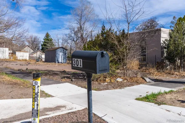 a sign board on the side of the road
