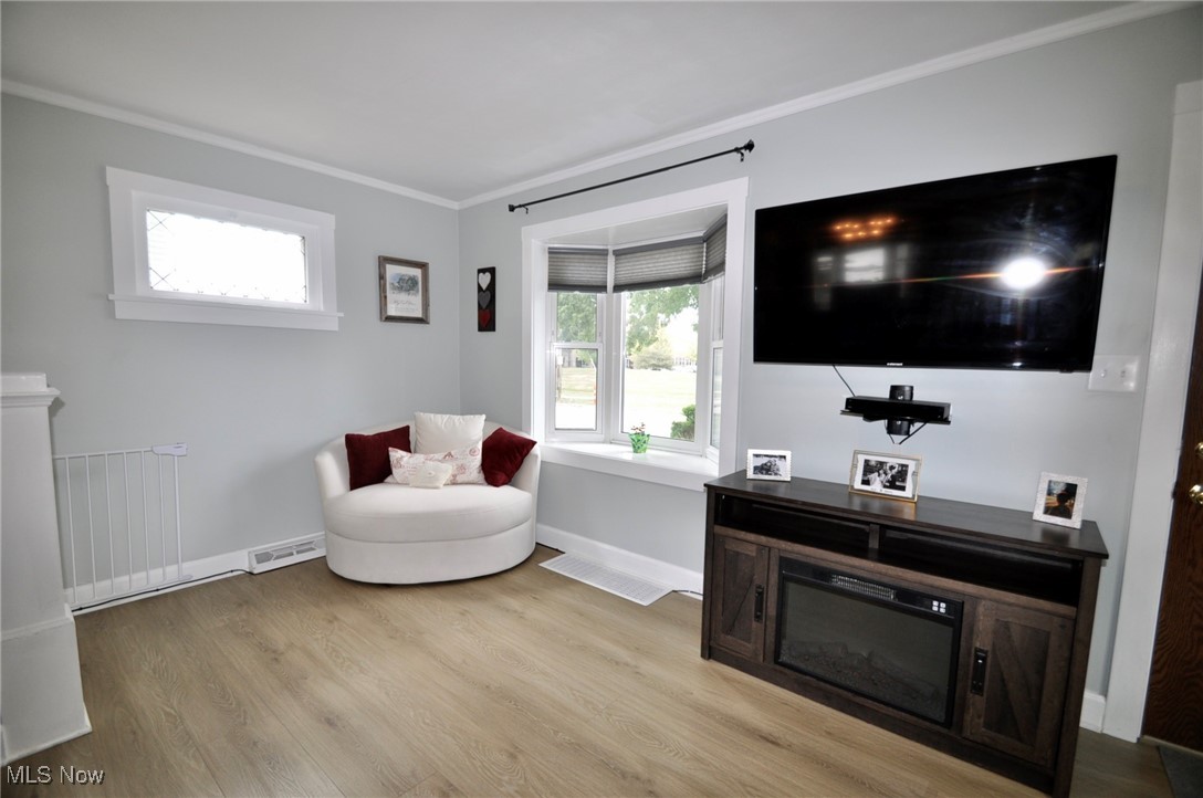 467 Cahoon Road Bay Village, OH 44140 - Photo 7 of 41 Sitting room with light wood-style flooring and crown molding