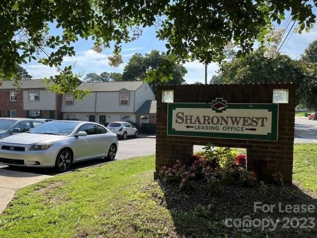 a view of a sign that is sitting in the grass