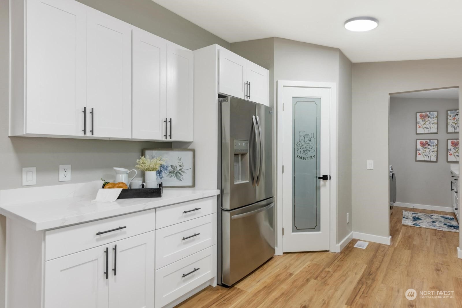 20500 32nd Drive Southeast Bothell, WA 98012 - Photo 5 of 28 a kitchen with stainless steel appliances white cabinets and a refrigerator