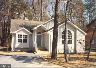18 Rabbit Run Lane Ocean Pines, MD 21811 - Photo 1 of 1 a house with trees in the background