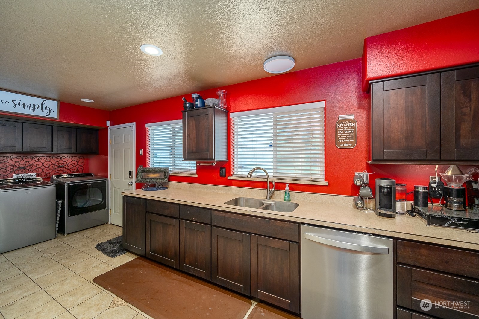 9015 Bong Loop, Unit 9017 Moses Lake, WA 98837 - Photo 11 of 26 a kitchen with stainless steel appliances a sink stove and cabinets