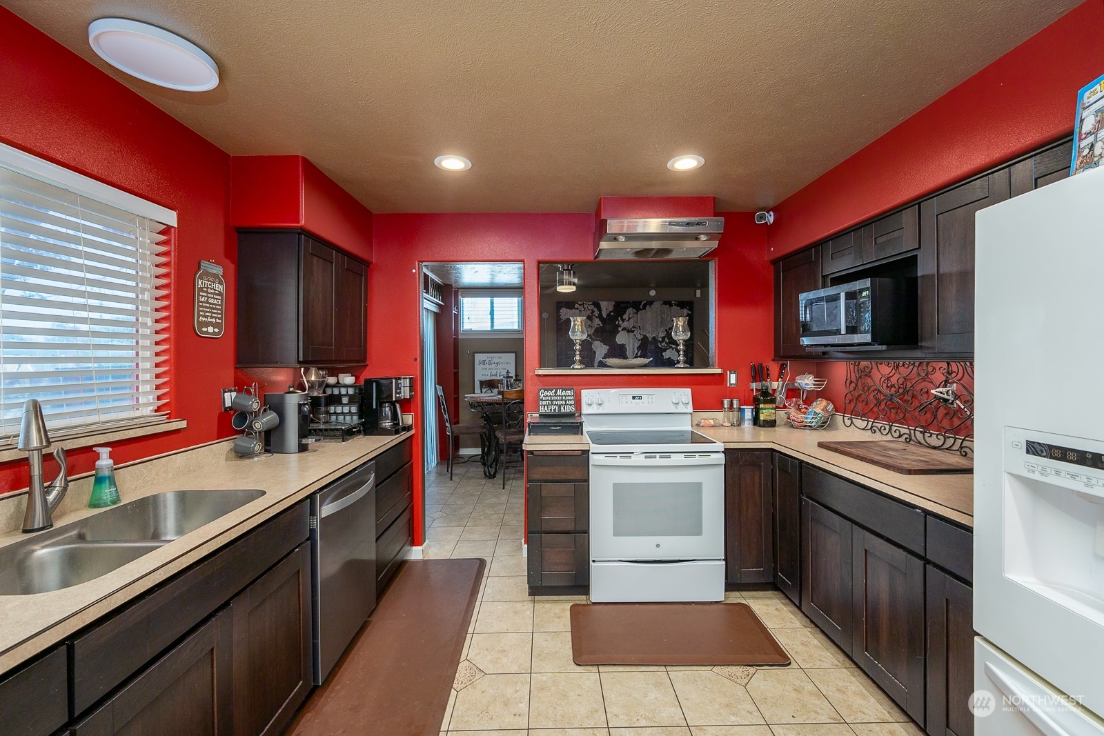 9015 Bong Loop, Unit 9017 Moses Lake, WA 98837 - Photo 14 of 26 a kitchen with stainless steel appliances granite countertop a sink and cabinets