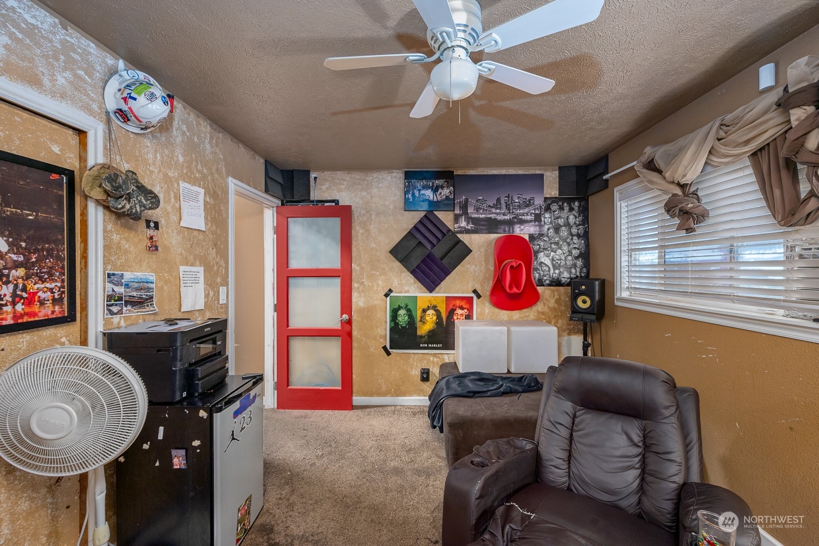 9015 Bong Loop, Unit 9017 Moses Lake, WA 98837 - Photo 19 of 26 a bedroom with furniture and a chandelier
