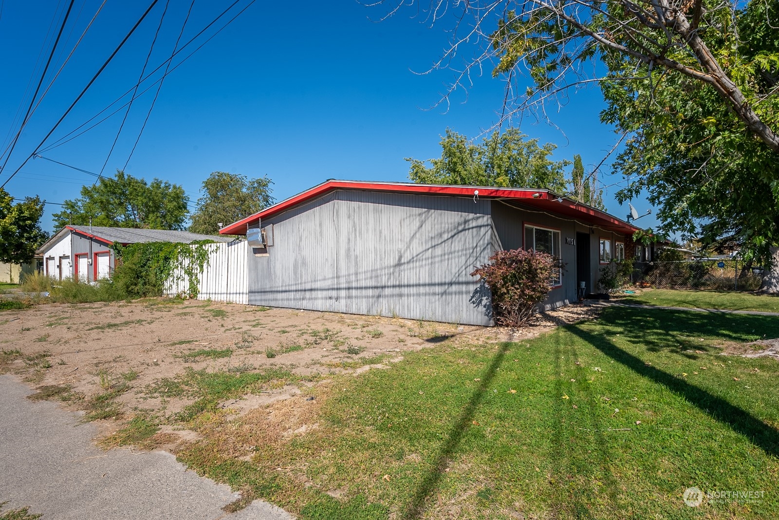 9015 Bong Loop, Unit 9017 Moses Lake, WA 98837 - Photo 24 of 26 a view of a house with a yard