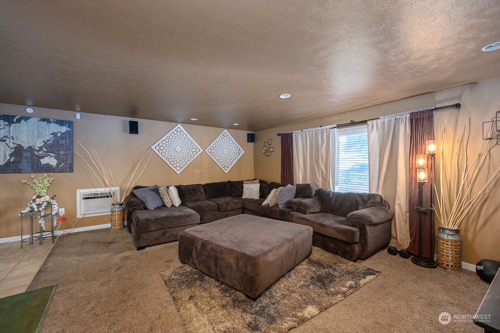 9015 Bong Loop, Unit 9017 Moses Lake, WA 98837 - Photo 5 of 26 a living room with furniture and a large window