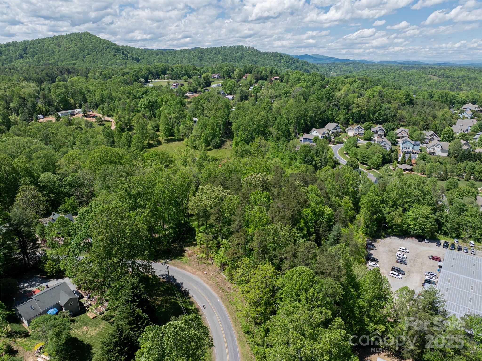99999 Brevard Road Mills River, NC 28759 - Photo 11 of 13 an aerial view of a house with a yard