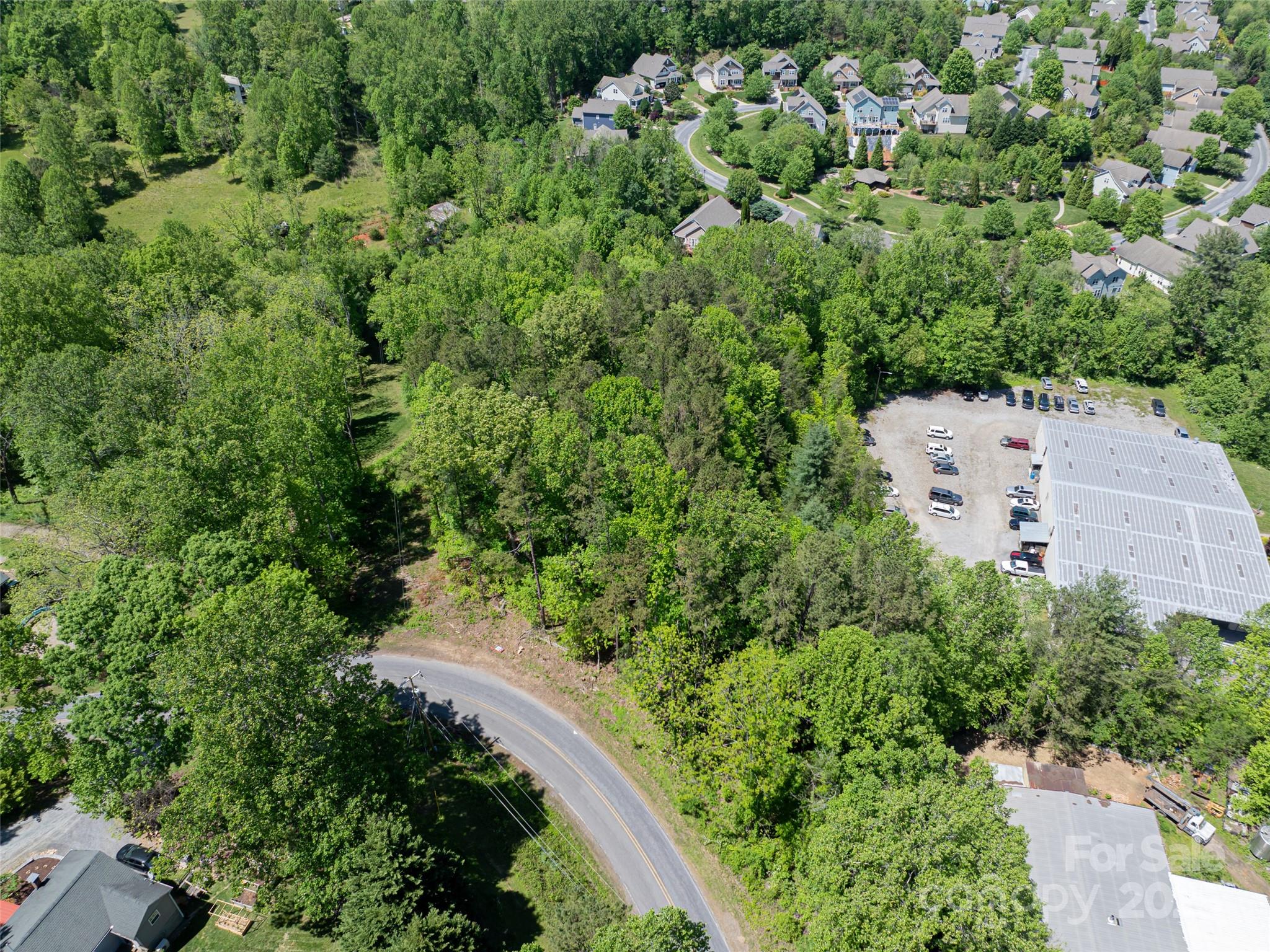 99999 Brevard Road Mills River, NC 28759 - Photo 12 of 13 an aerial view of a house with a yard