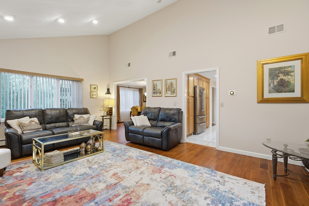 22 Magnolia Road Sharon, MA 02067 - Photo 11 of 42 a living room with furniture and a wooden floor