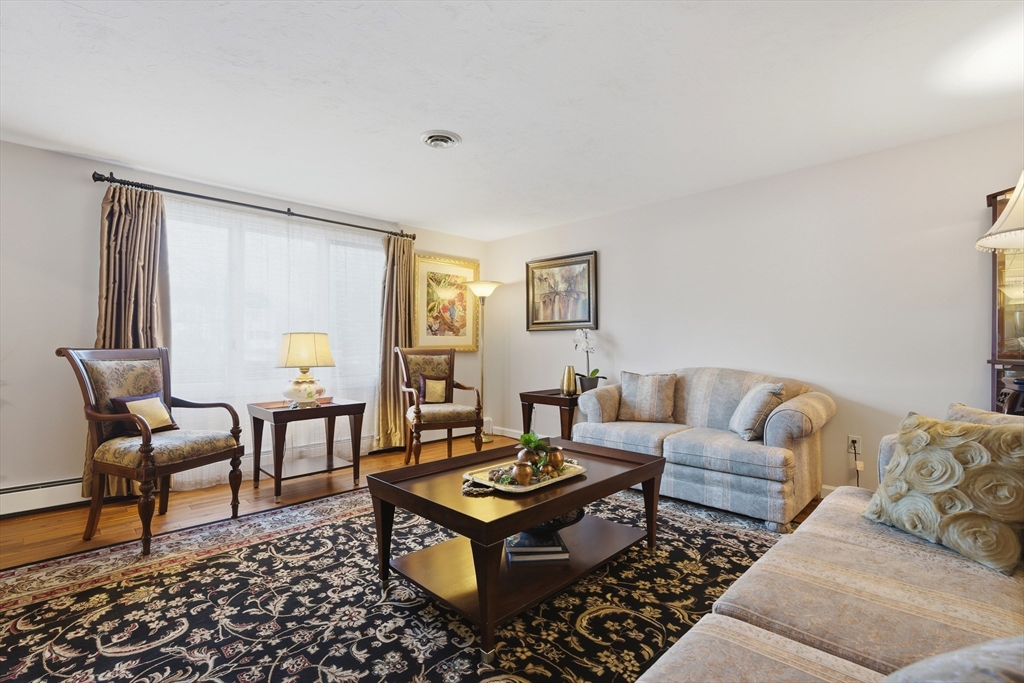 22 Magnolia Road Sharon, MA 02067 - Photo 16 of 42 a living room with furniture and a rug
