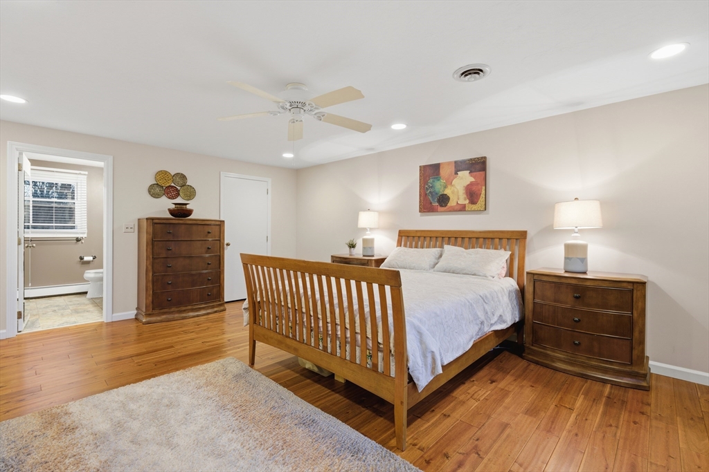 22 Magnolia Road Sharon, MA 02067 - Photo 19 of 42 a spacious bedroom with a bed and a walk in closet