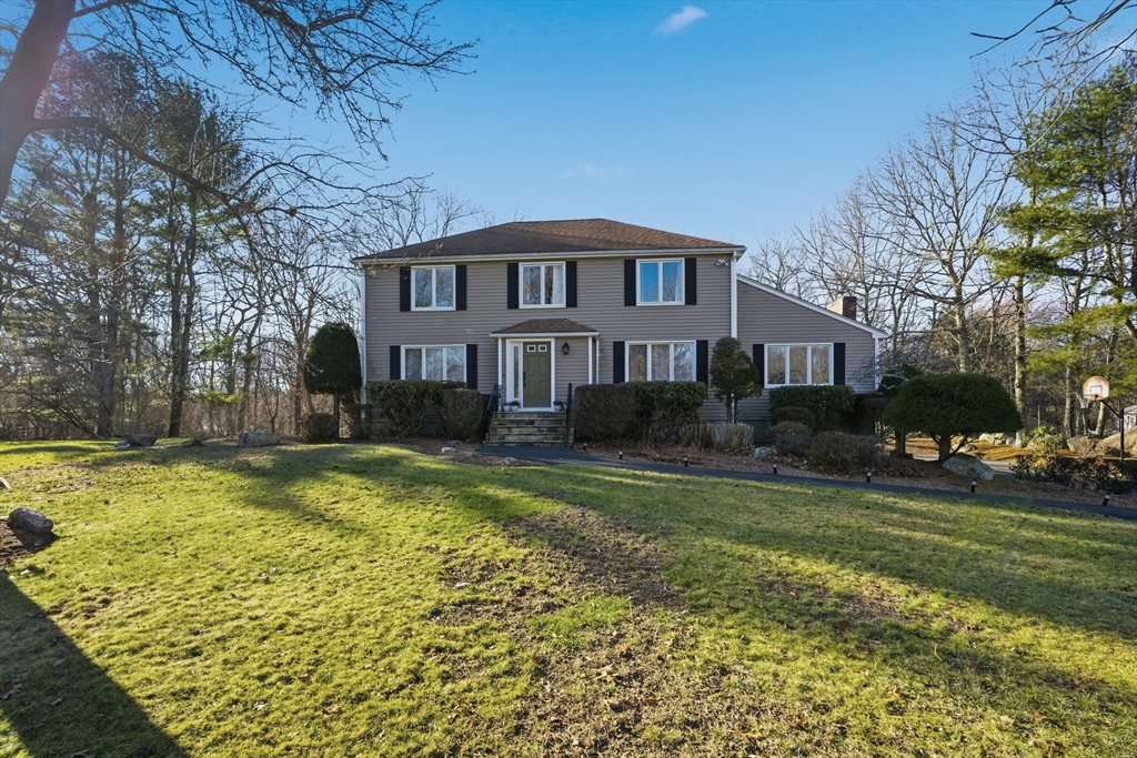 22 Magnolia Road Sharon, MA 02067 - Photo 2 of 42 a front view of a house with a yard table and chairs