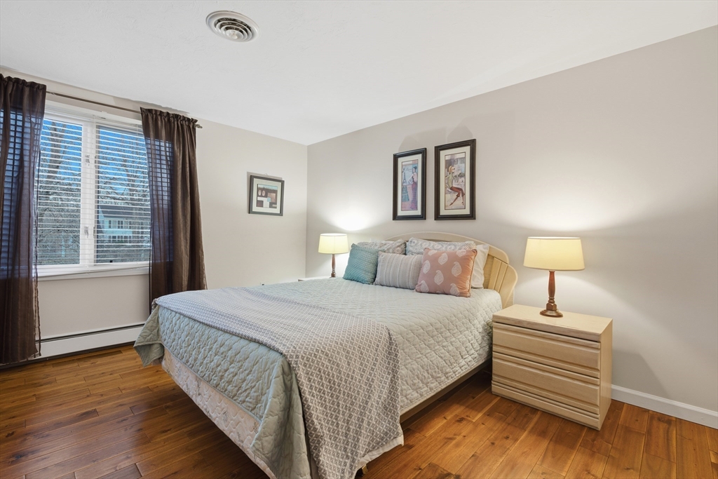22 Magnolia Road Sharon, MA 02067 - Photo 22 of 42 a bedroom with a bed and a night stand