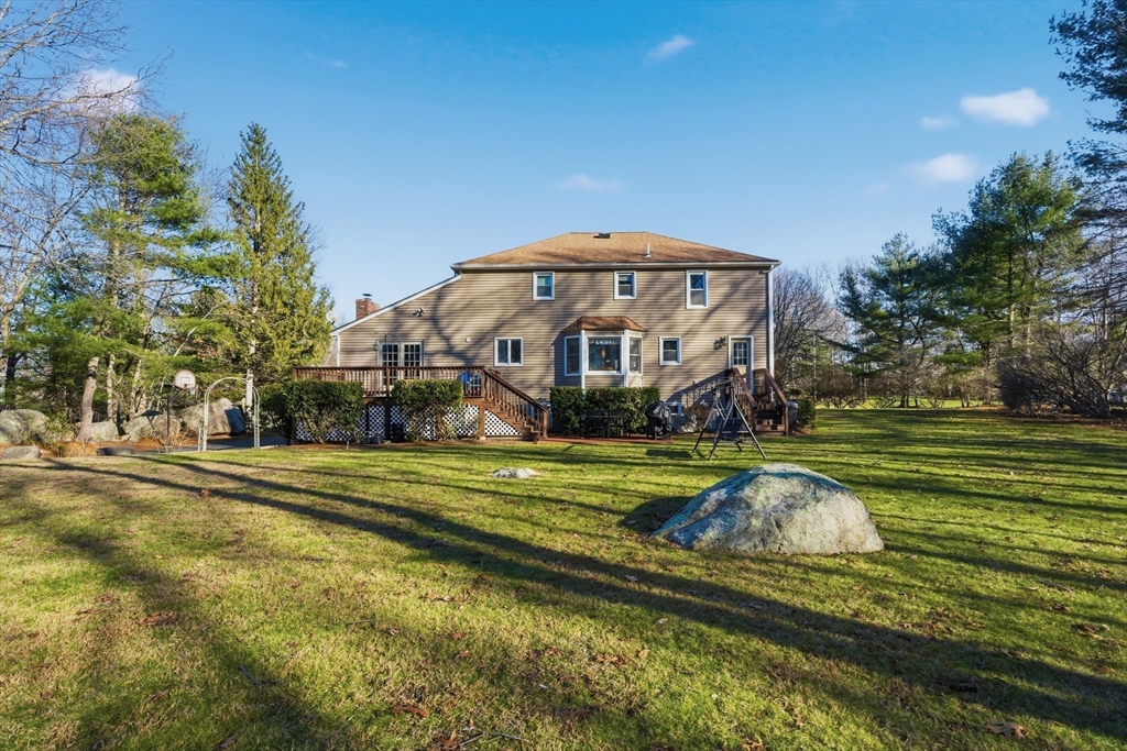 22 Magnolia Road Sharon, MA 02067 - Photo 35 of 42 a view of a big house with a big yard