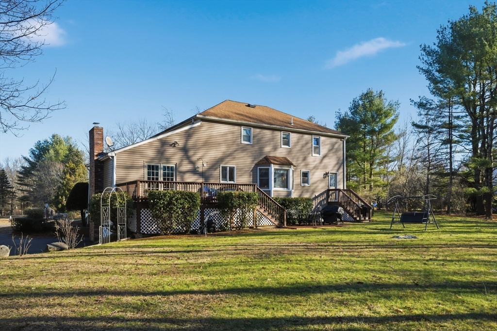 22 Magnolia Road Sharon, MA 02067 - Photo 36 of 42 a view of a big house with a big yard