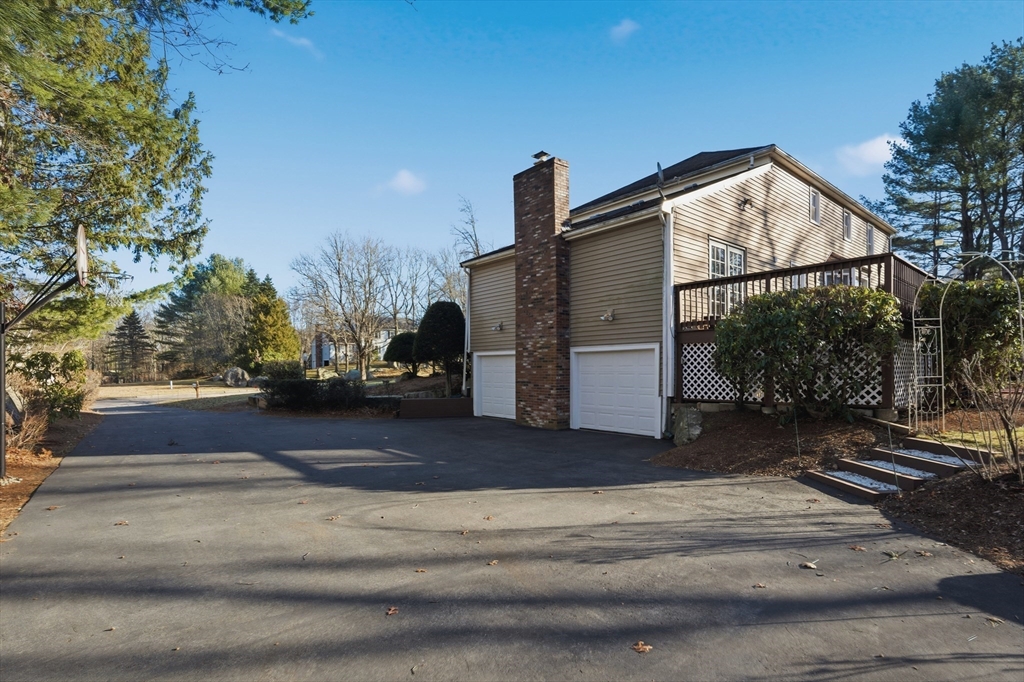 22 Magnolia Road Sharon, MA 02067 - Photo 39 of 42 a view of a house with a yard