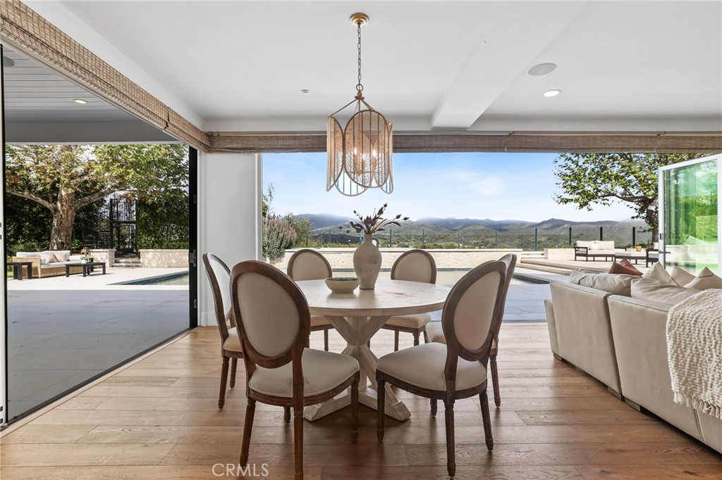48 Panorama Coto de Caza, CA 92679 - Photo 13 of 66 a dining room with furniture a chandelier and wooden floor