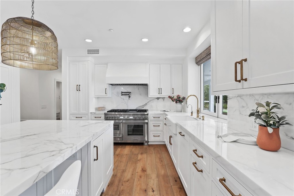 48 Panorama Coto de Caza, CA 92679 - Photo 16 of 66 a large kitchen with stainless steel appliances granite countertop a lot of counter space and wooden floor