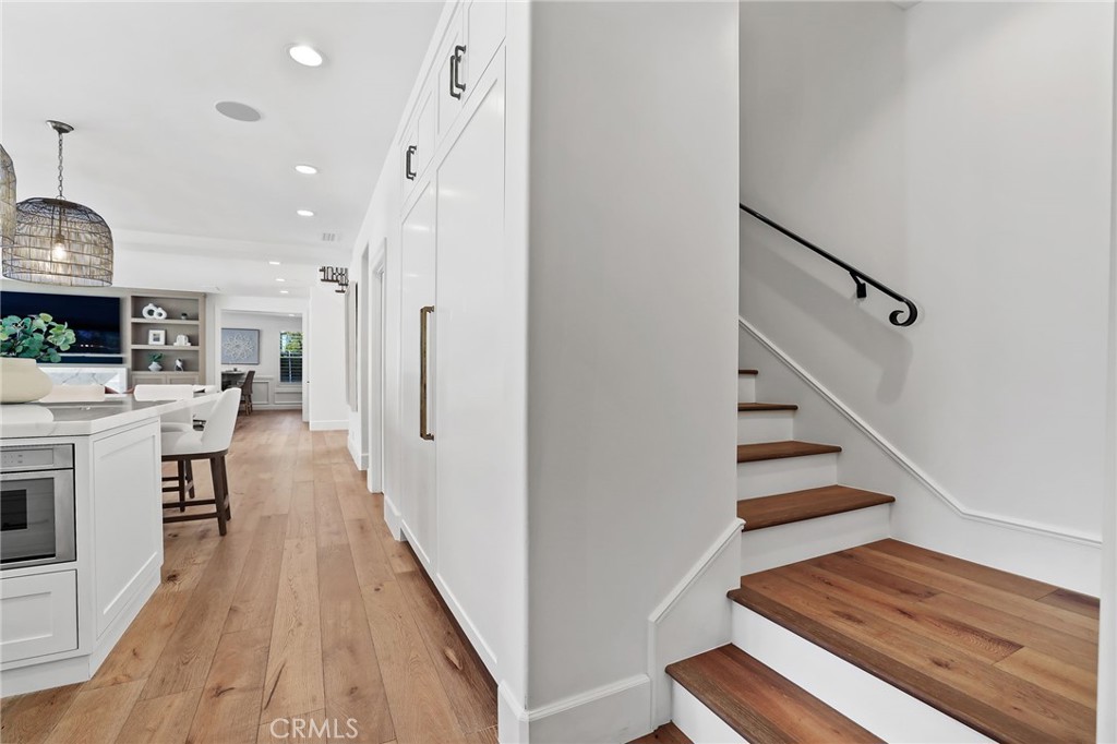 48 Panorama Coto de Caza, CA 92679 - Photo 18 of 66 a view of a hallway with wooden floor and staircase