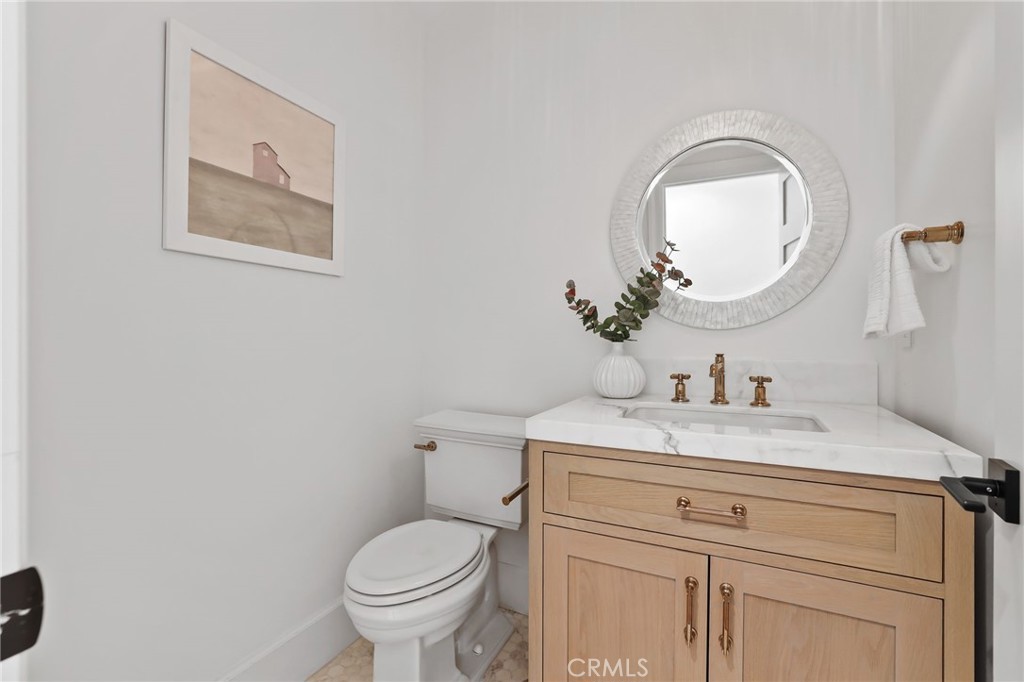48 Panorama Coto de Caza, CA 92679 - Photo 25 of 66 a bathroom with a toilet sink vanity and mirror
