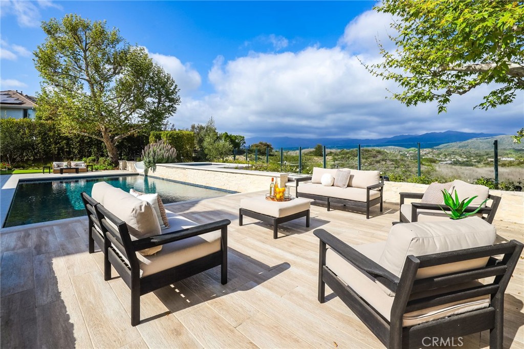 48 Panorama Coto de Caza, CA 92679 - Photo 52 of 66 a view of a terrace with couches and a fire pit
