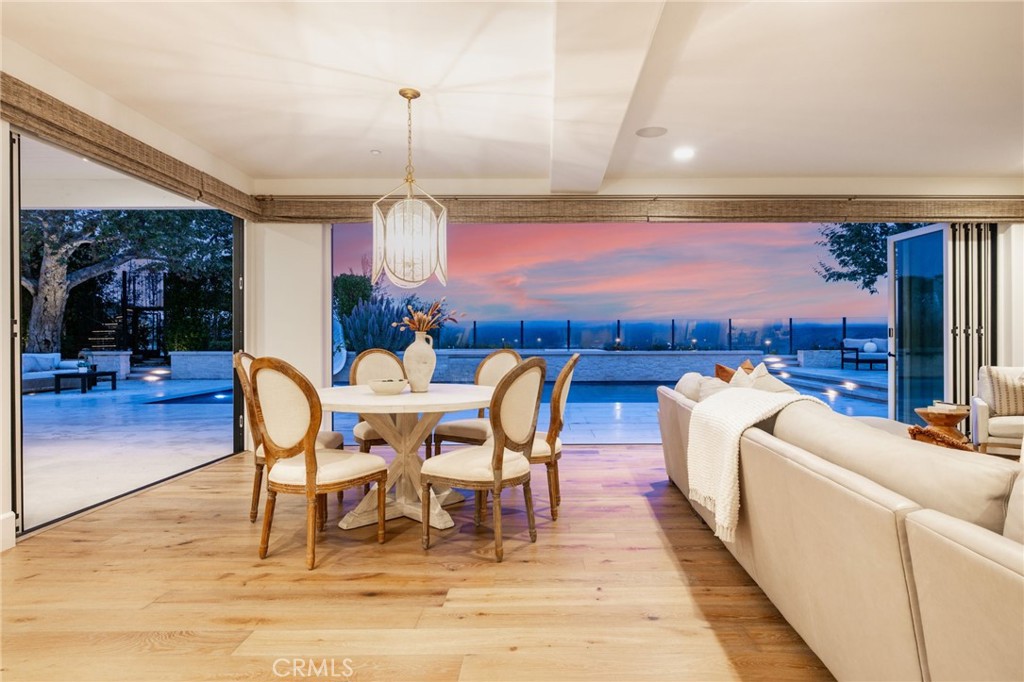 48 Panorama Coto de Caza, CA 92679 - Photo 60 of 66 a dining room with furniture a chandelier and wooden floor