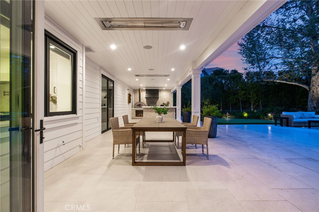 48 Panorama Coto de Caza, CA 92679 - Photo 61 of 66 a view of a patio with table and chairs potted plants with wooden floor and fence