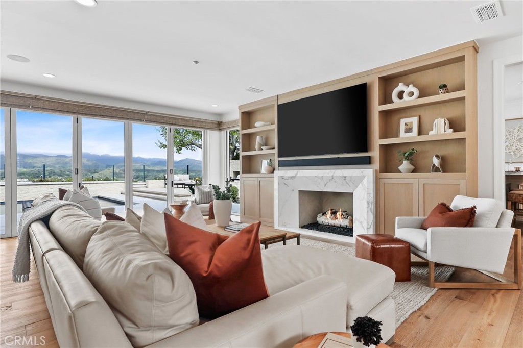 48 Panorama Coto de Caza, CA 92679 - Photo 10 of 66 a living room with furniture fireplace and a flat screen tv