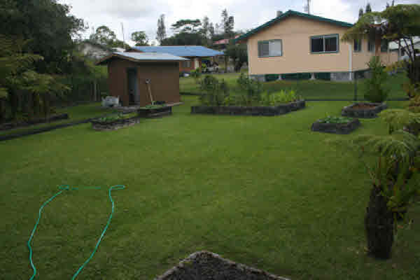 18-7858 Henele Road Mountain View, HI 96771 - Photo 9 of 24 a view of a house with a yard and sitting area