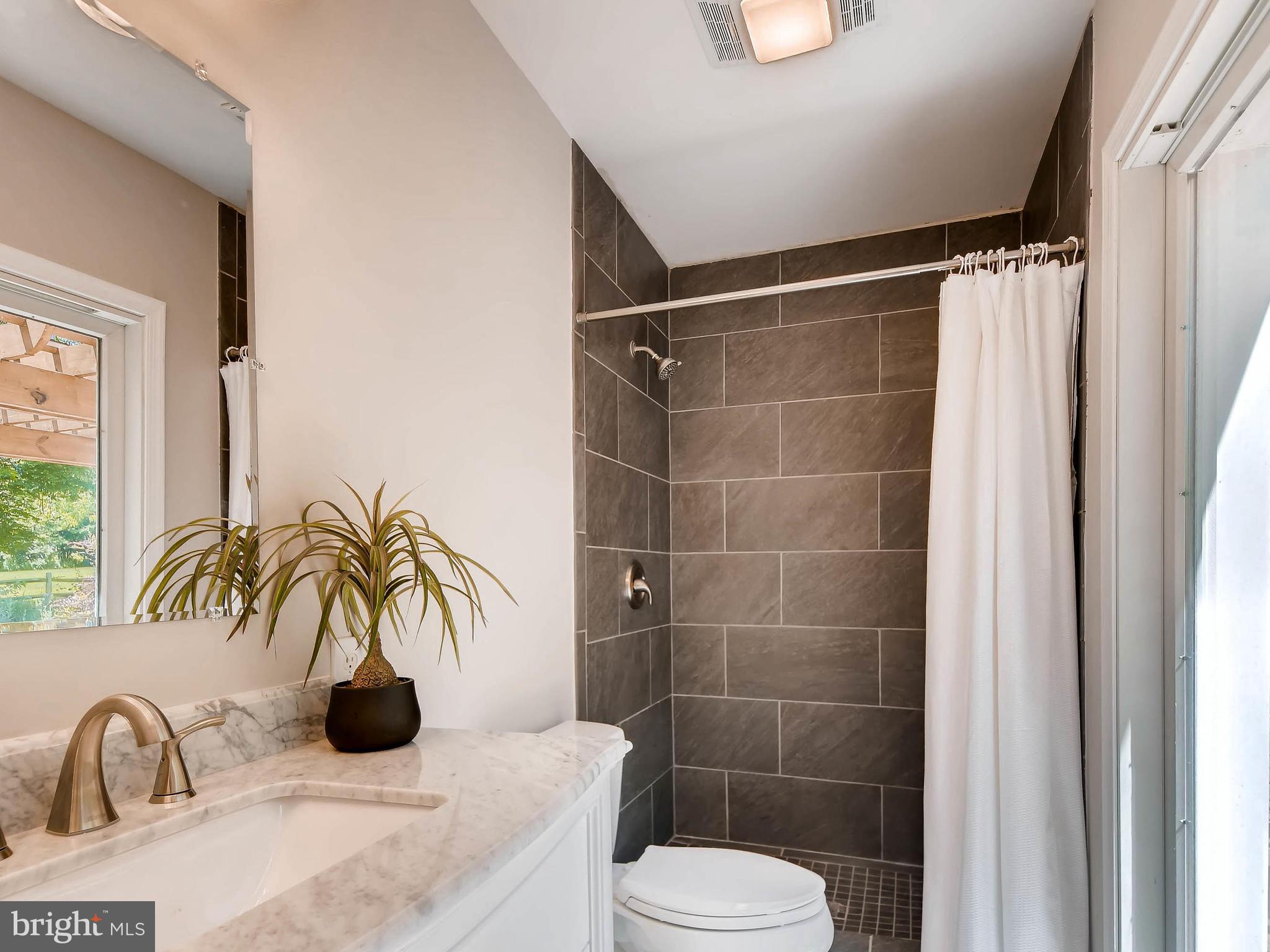 13701 Bardon Road Phoenix, MD 21131 - Photo 15 of 30 a bathroom with a sink toilet and shower