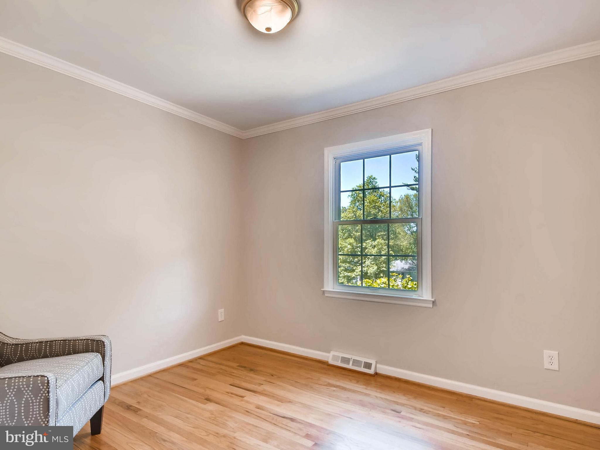 13701 Bardon Road Phoenix, MD 21131 - Photo 16 of 30 a view of a room with wooden floor and windows