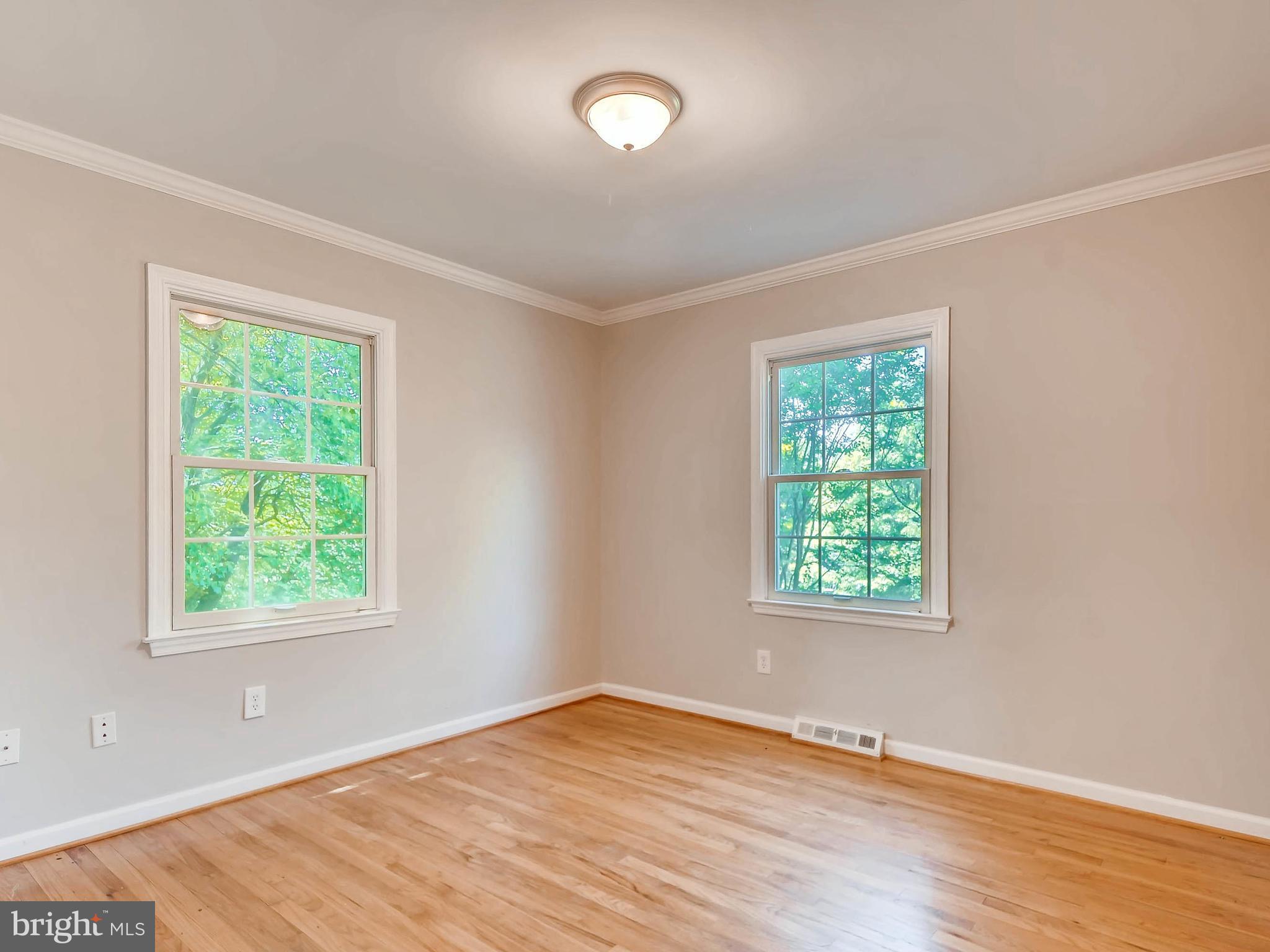 13701 Bardon Road Phoenix, MD 21131 - Photo 18 of 30 a view of an empty room with wooden floor and a window