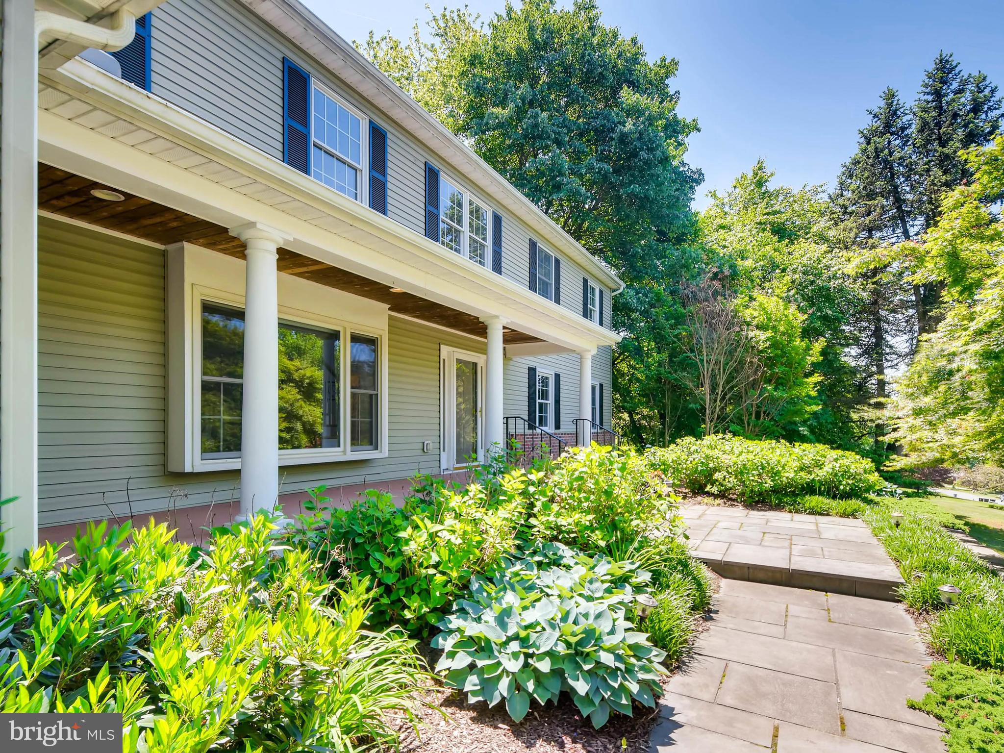 13701 Bardon Road Phoenix, MD 21131 - Photo 3 of 30 a house with a flower garden in front of it