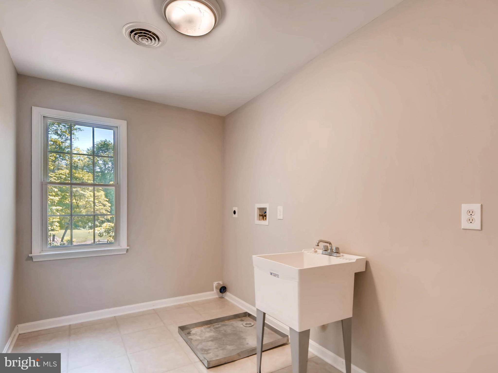13701 Bardon Road Phoenix, MD 21131 - Photo 26 of 30 a bathroom with a sink and a window