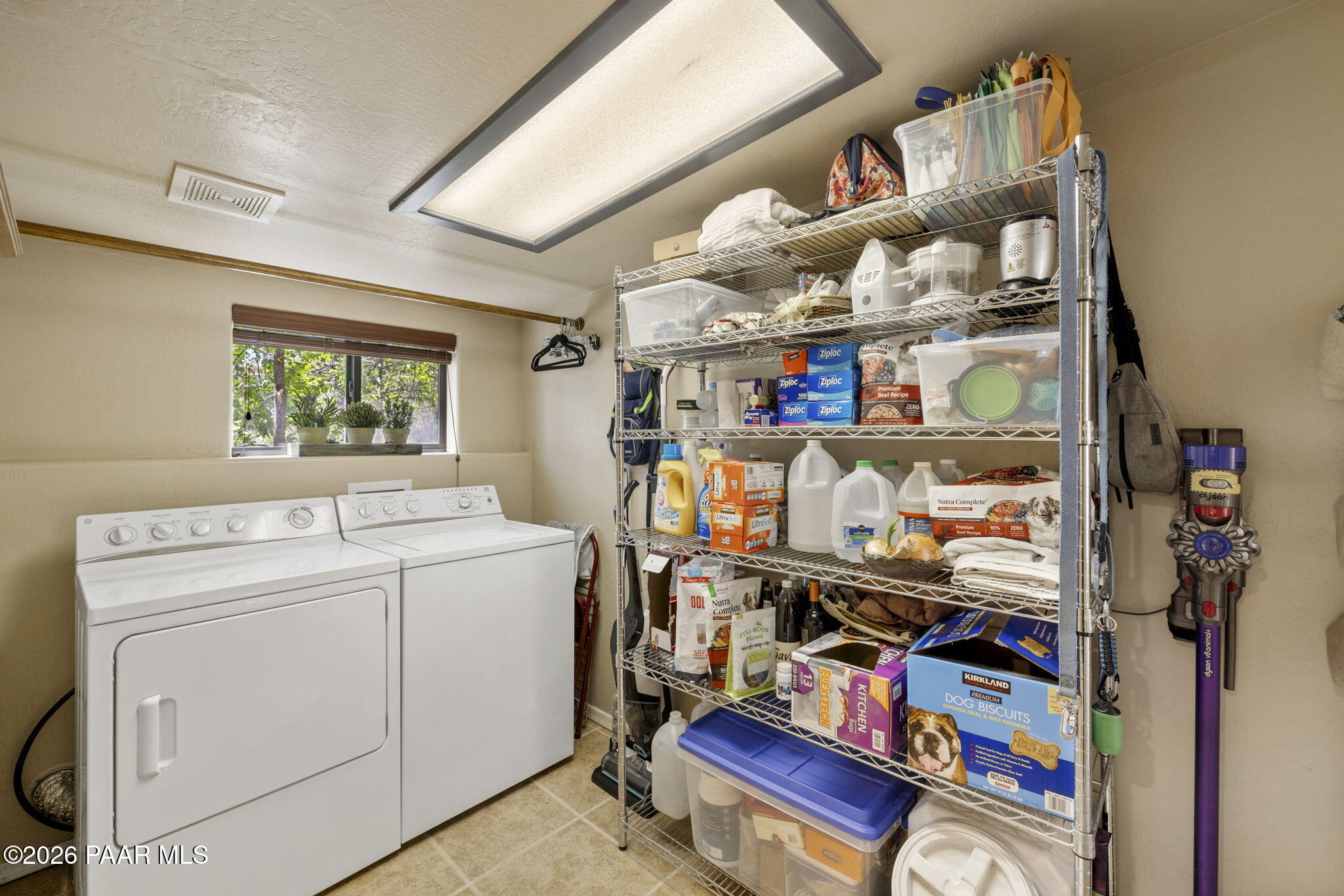 535 Copper Basin Road Prescott, AZ 86303 - Photo 33 of 41 a storage room with washer and dryer