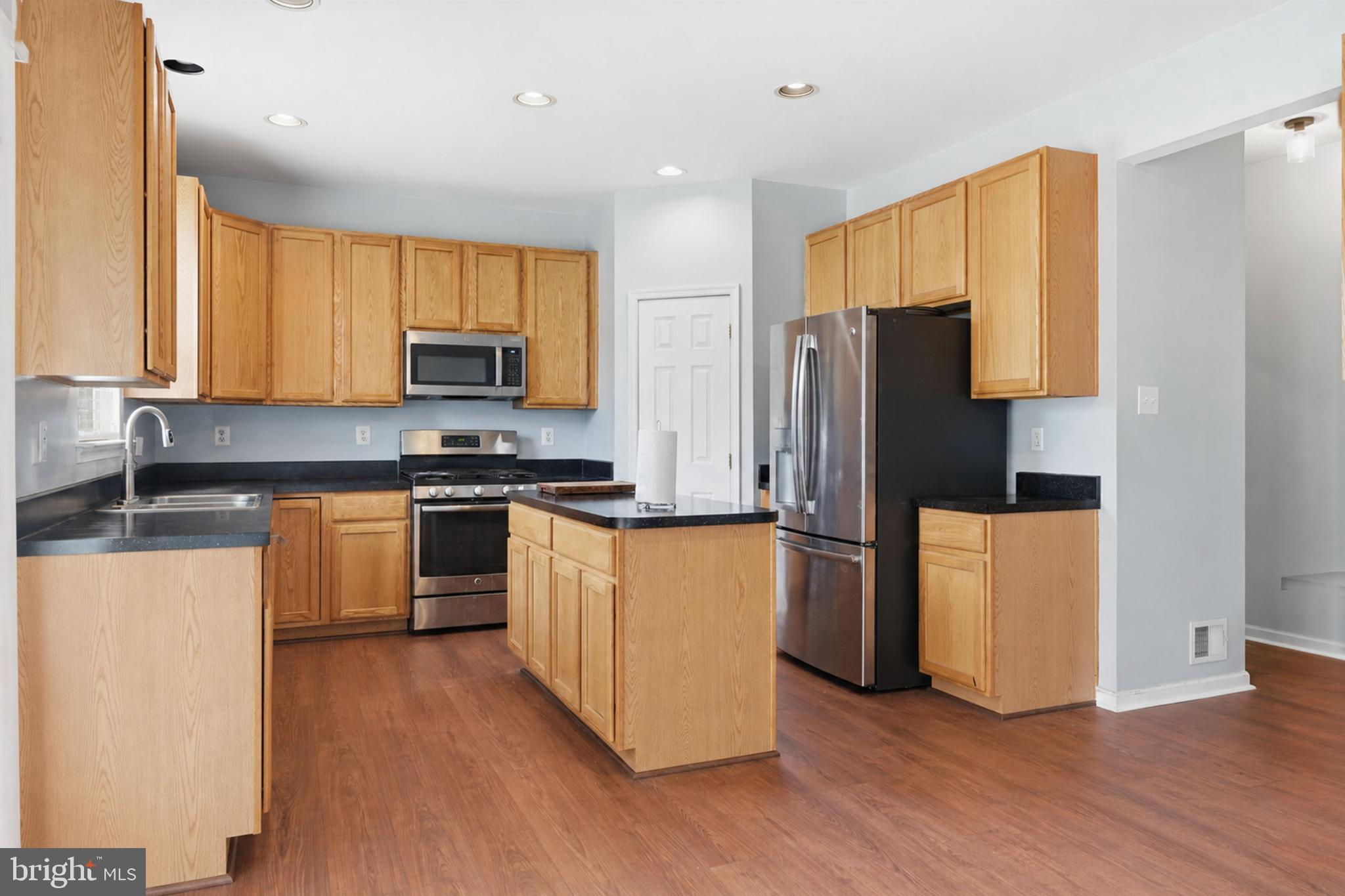 24 Overbrook Road Ranson, WV 25438 - Photo 2 of 21 a kitchen with stainless steel appliances a refrigerator and a stove top oven