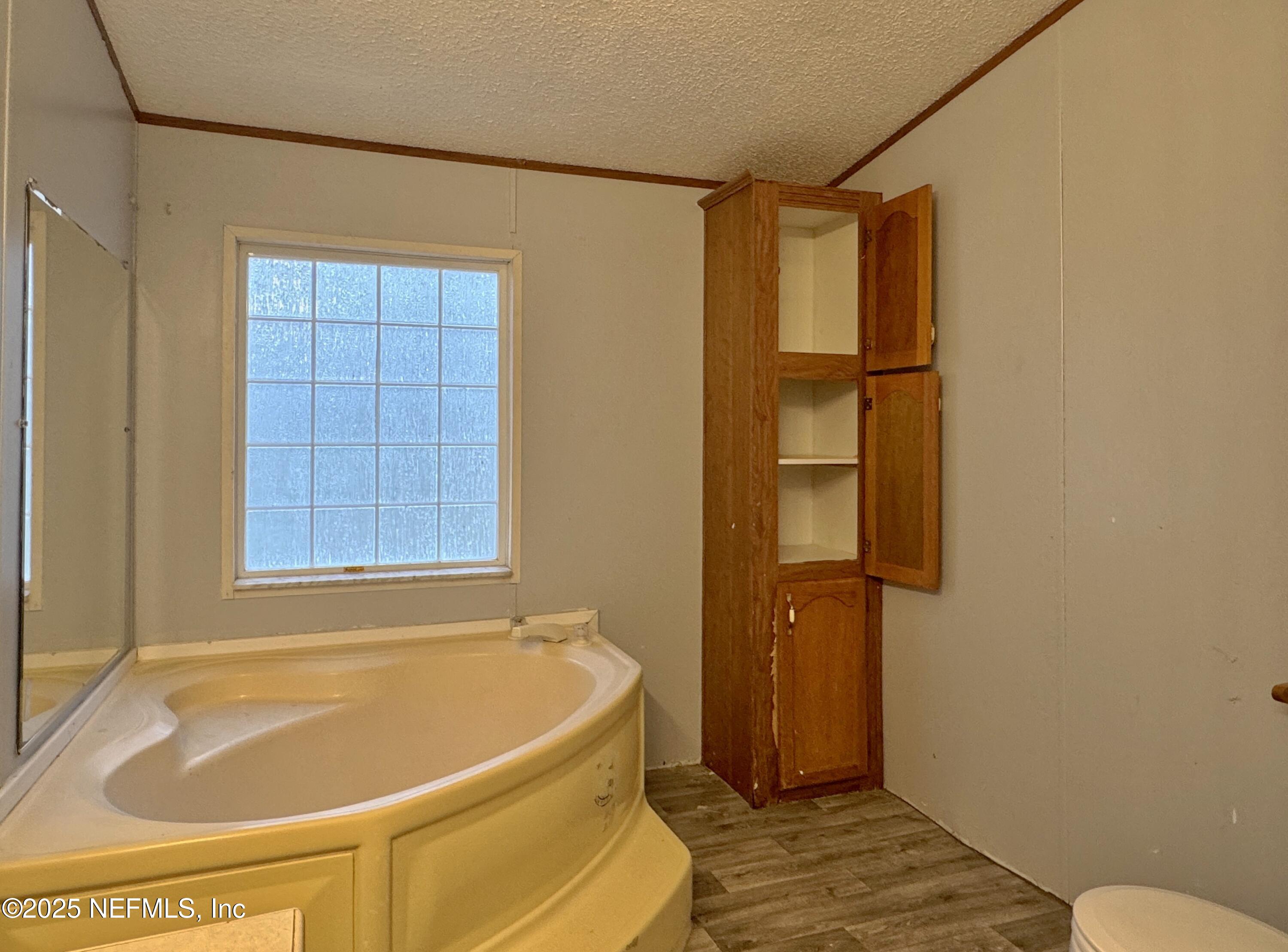 132 Long Road Interlachen, FL 32148 - Photo 13 of 21 a bathroom with a tub and shower