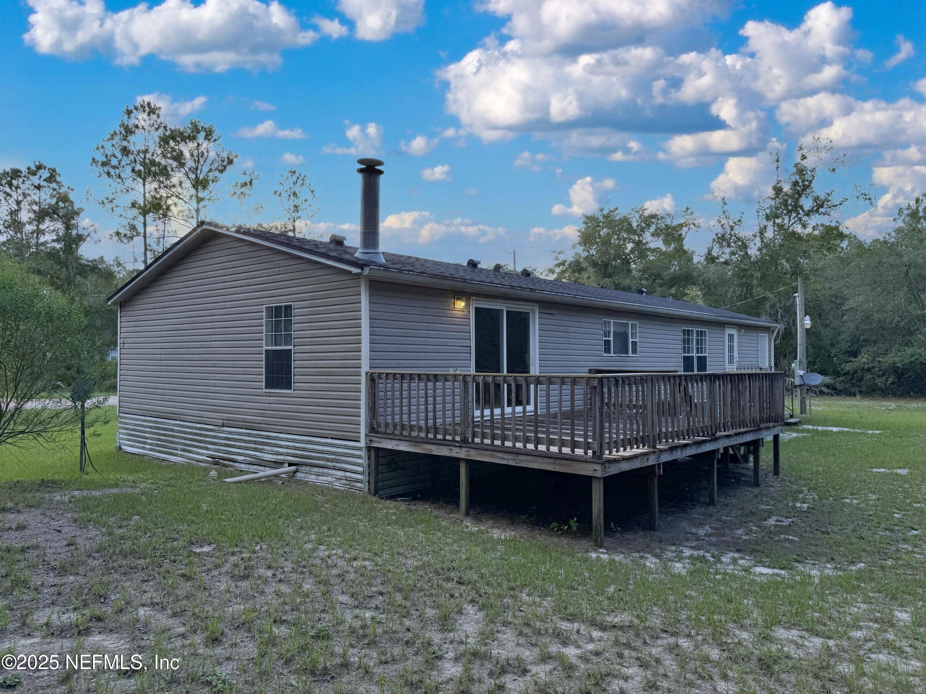 132 Long Road Interlachen, FL 32148 - Photo 4 of 21 a view of a house with a yard