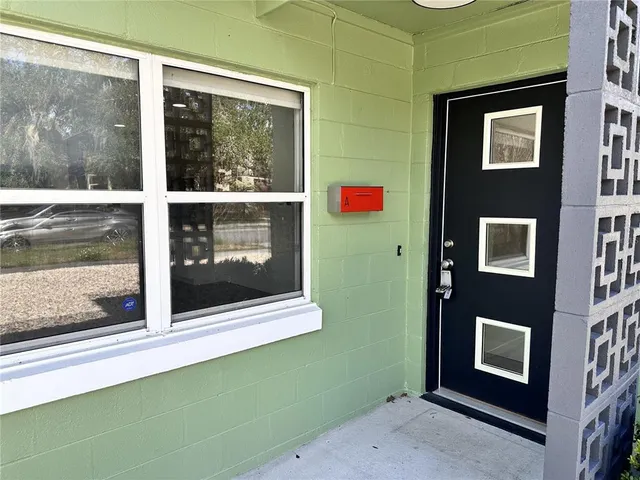 a view of a house with a door and a window