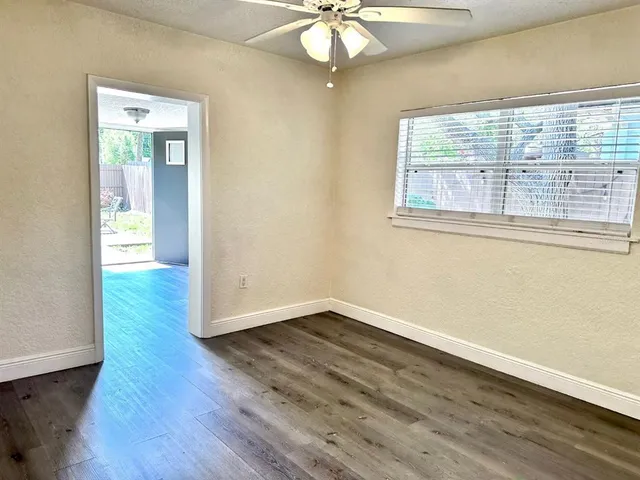a view of backyard with a patio