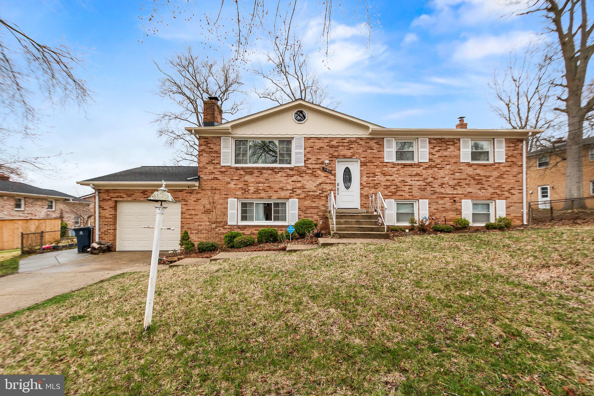 11411 Hermitt Street Clinton, MD 20735 - Photo 1 of 40 a front view of a house with a yard