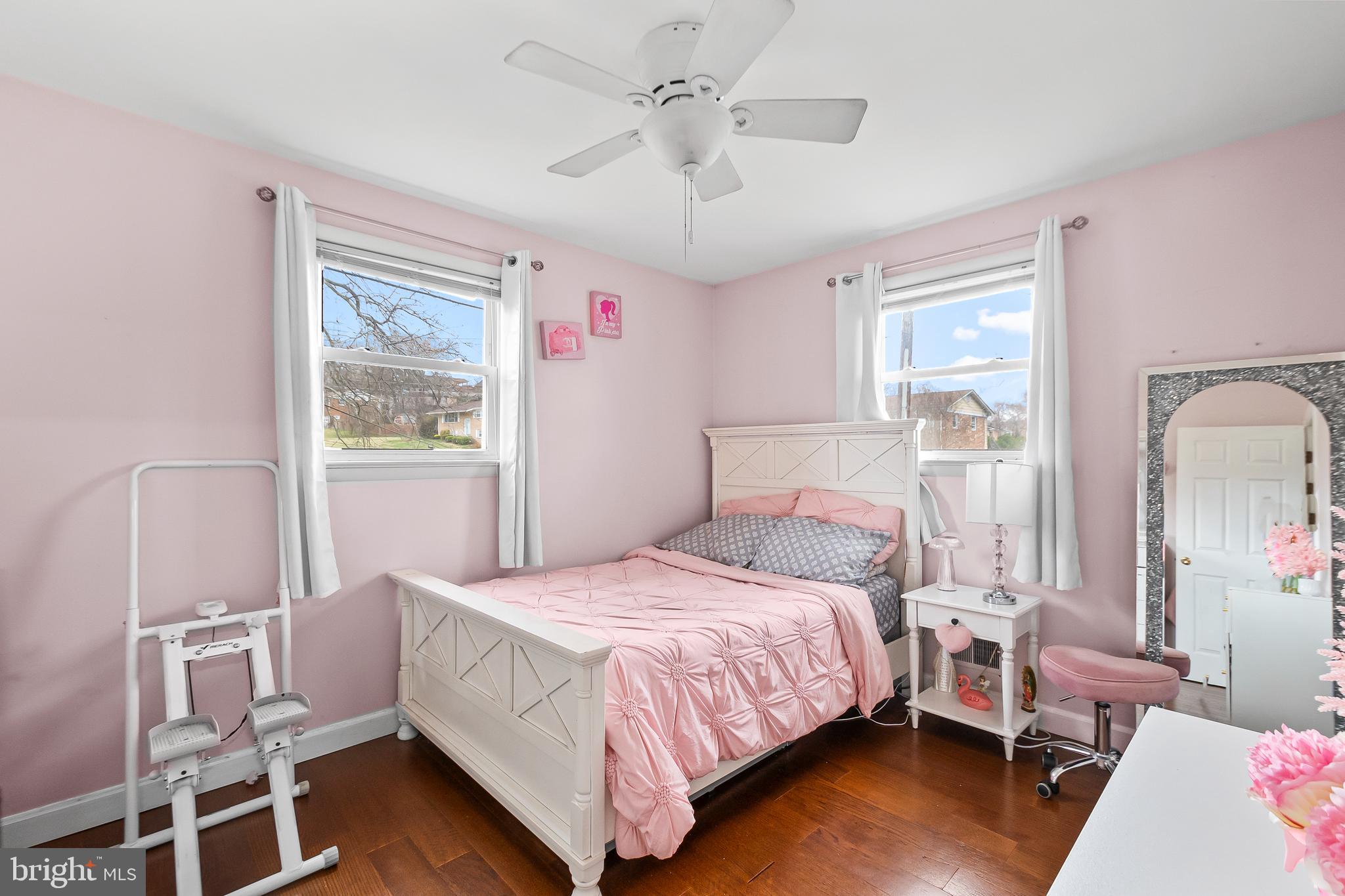 11411 Hermitt Street Clinton, MD 20735 - Photo 18 of 40 a bedroom with a bed wooden floor and window