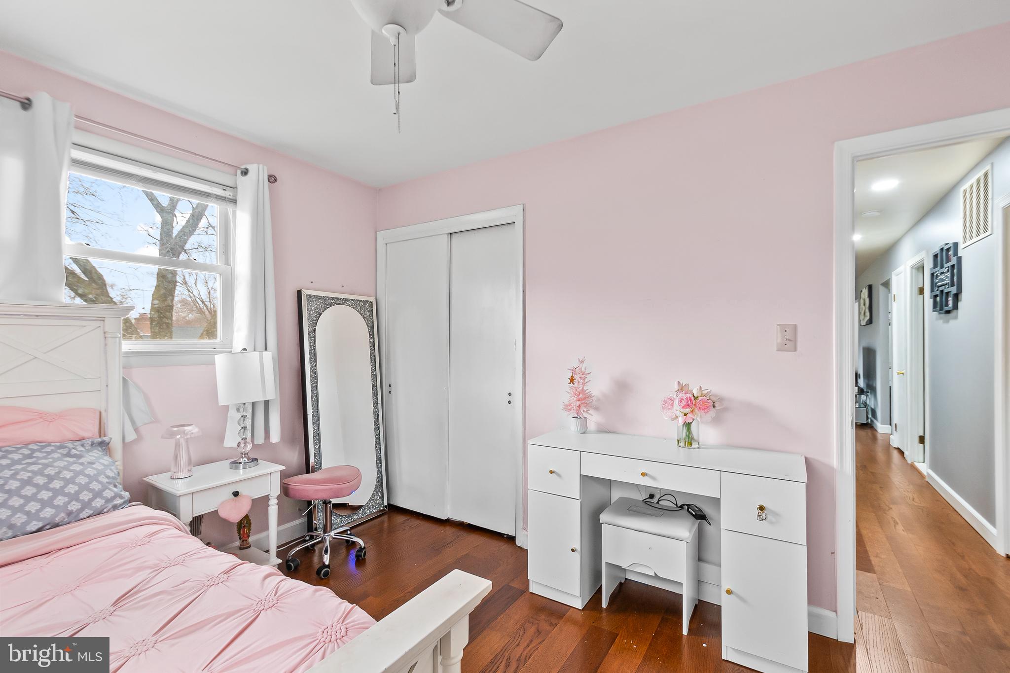 11411 Hermitt Street Clinton, MD 20735 - Photo 19 of 40 a bedroom with a bed and a chandelier