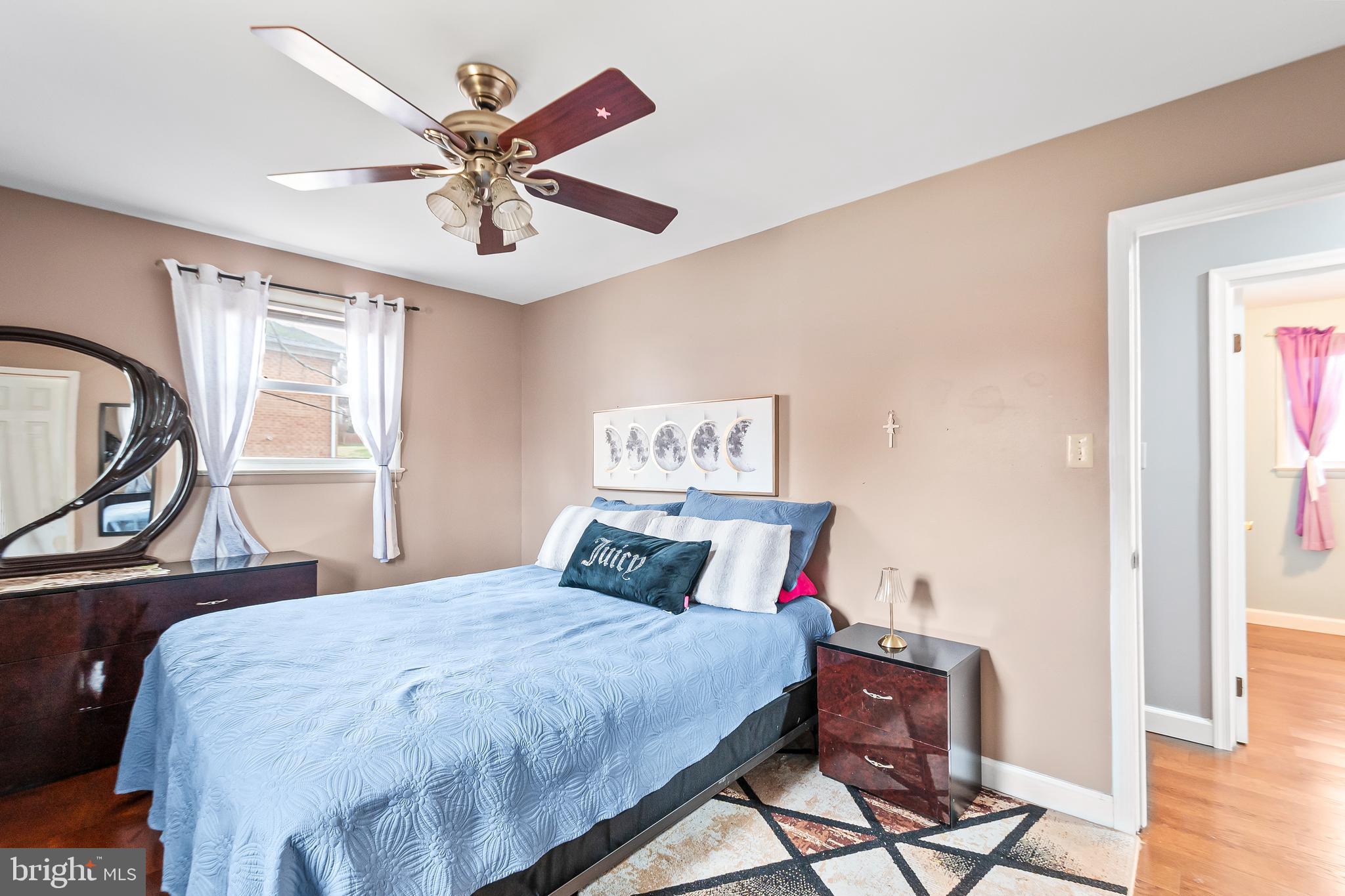 11411 Hermitt Street Clinton, MD 20735 - Photo 21 of 40 a bedroom with a bed and window