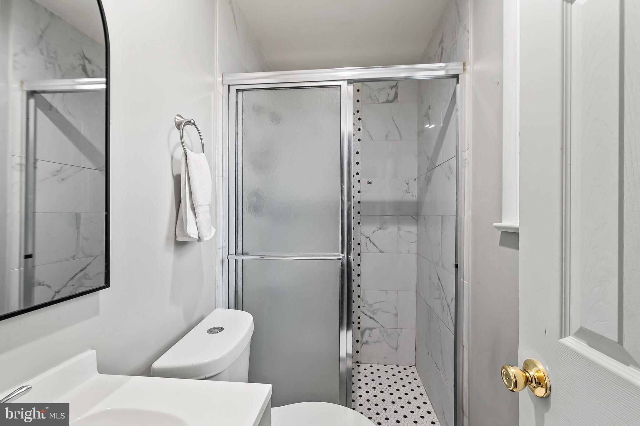 11411 Hermitt Street Clinton, MD 20735 - Photo 23 of 40 a bathroom with a shower and a toilet