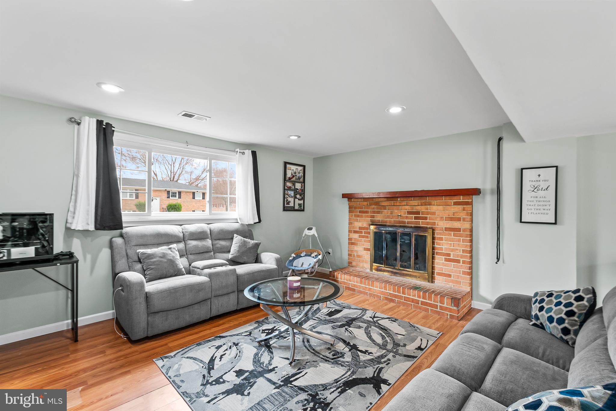 11411 Hermitt Street Clinton, MD 20735 - Photo 24 of 40 a living room with furniture and a fireplace