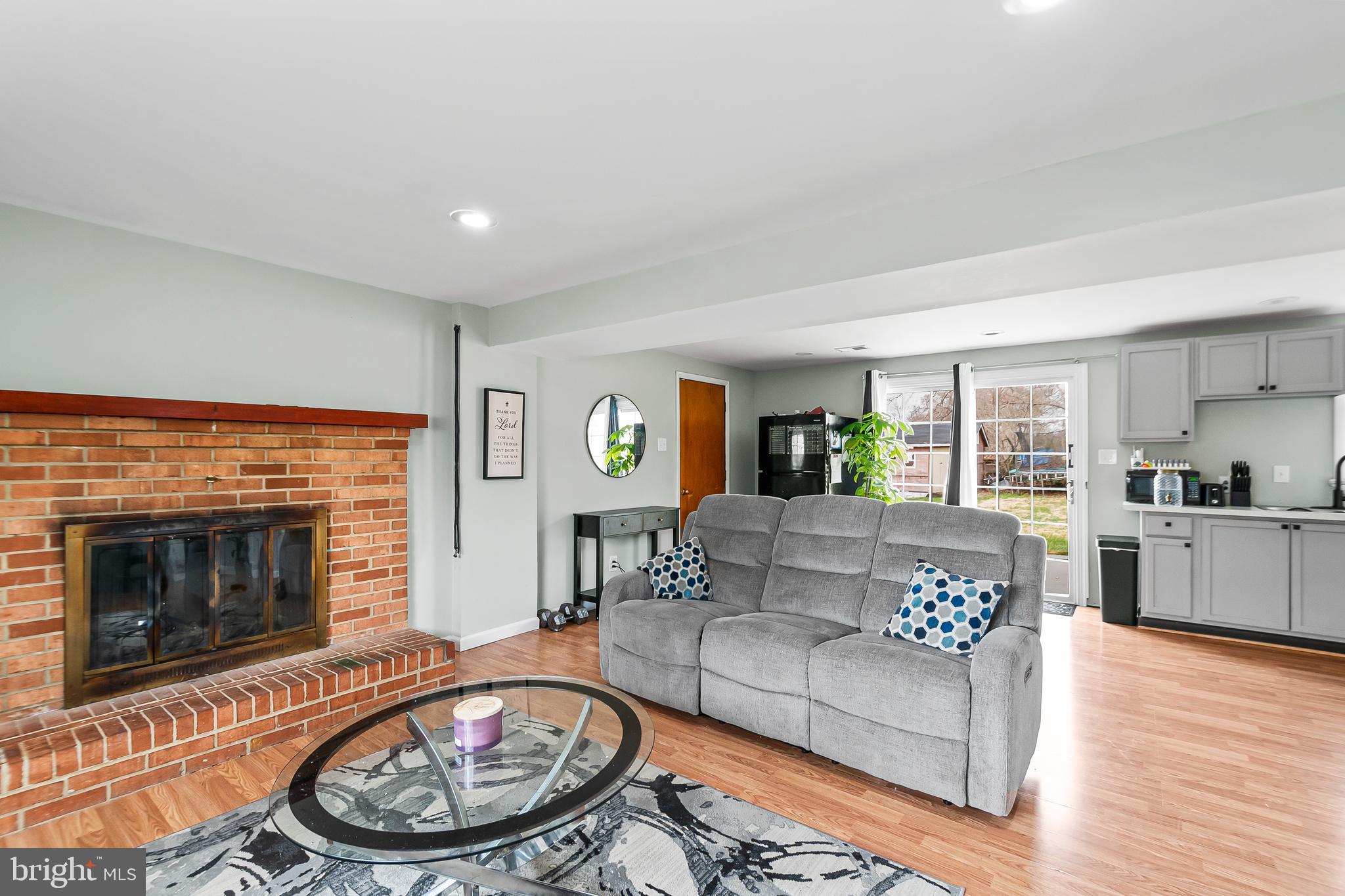 11411 Hermitt Street Clinton, MD 20735 - Photo 26 of 40 a living room with furniture and a fireplace