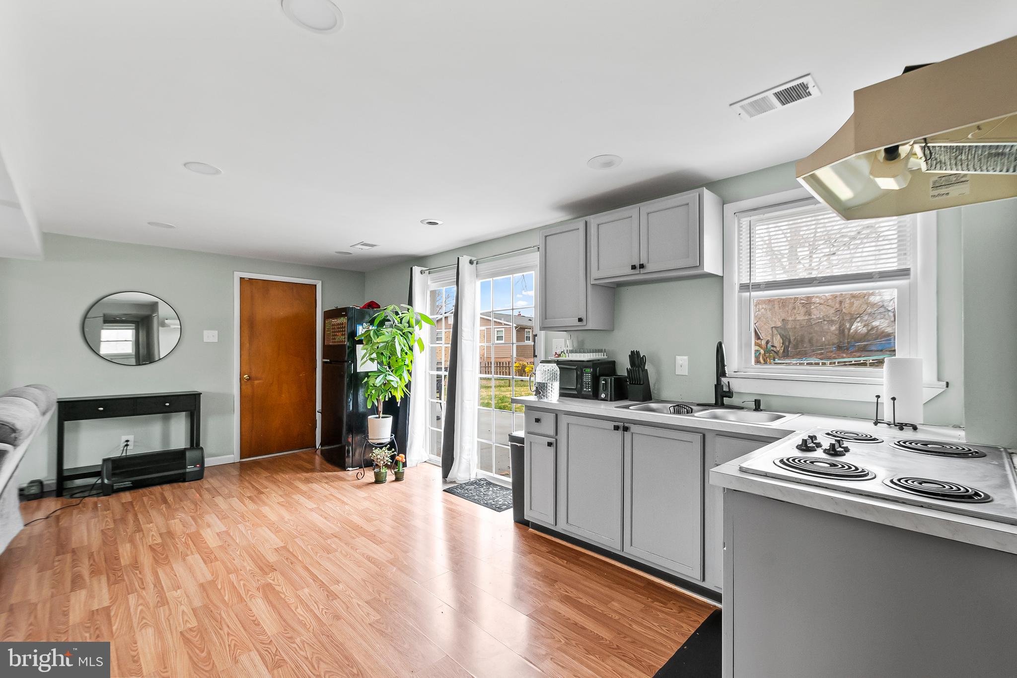 11411 Hermitt Street Clinton, MD 20735 - Photo 29 of 40 a kitchen with a sink stove and cabinets