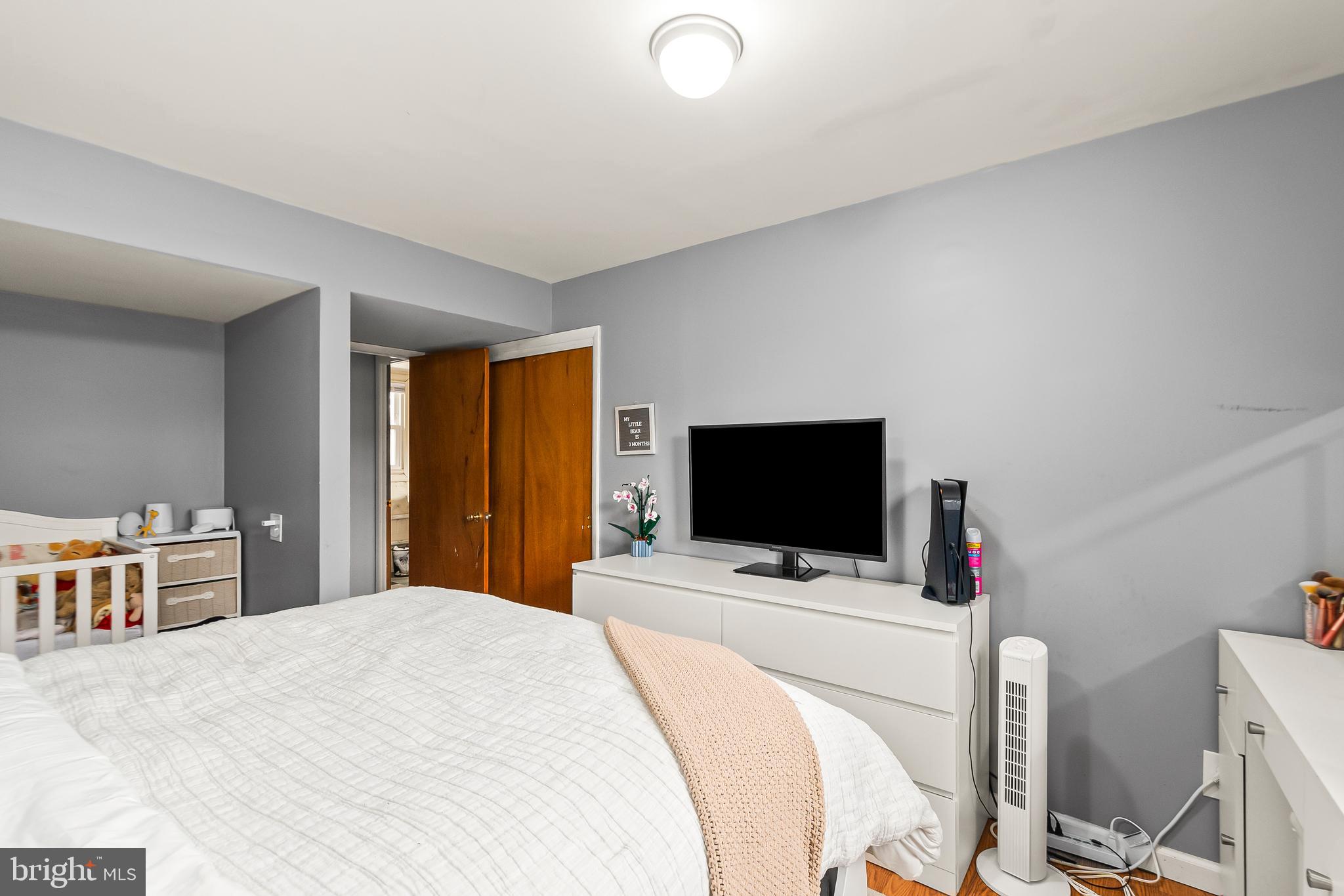 11411 Hermitt Street Clinton, MD 20735 - Photo 32 of 40 a bedroom with a bed and a flat screen tv