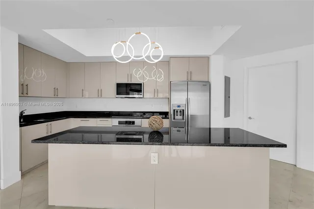a kitchen with a sink a stove and cabinets